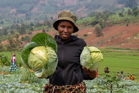 Woman in Rwanda with crops